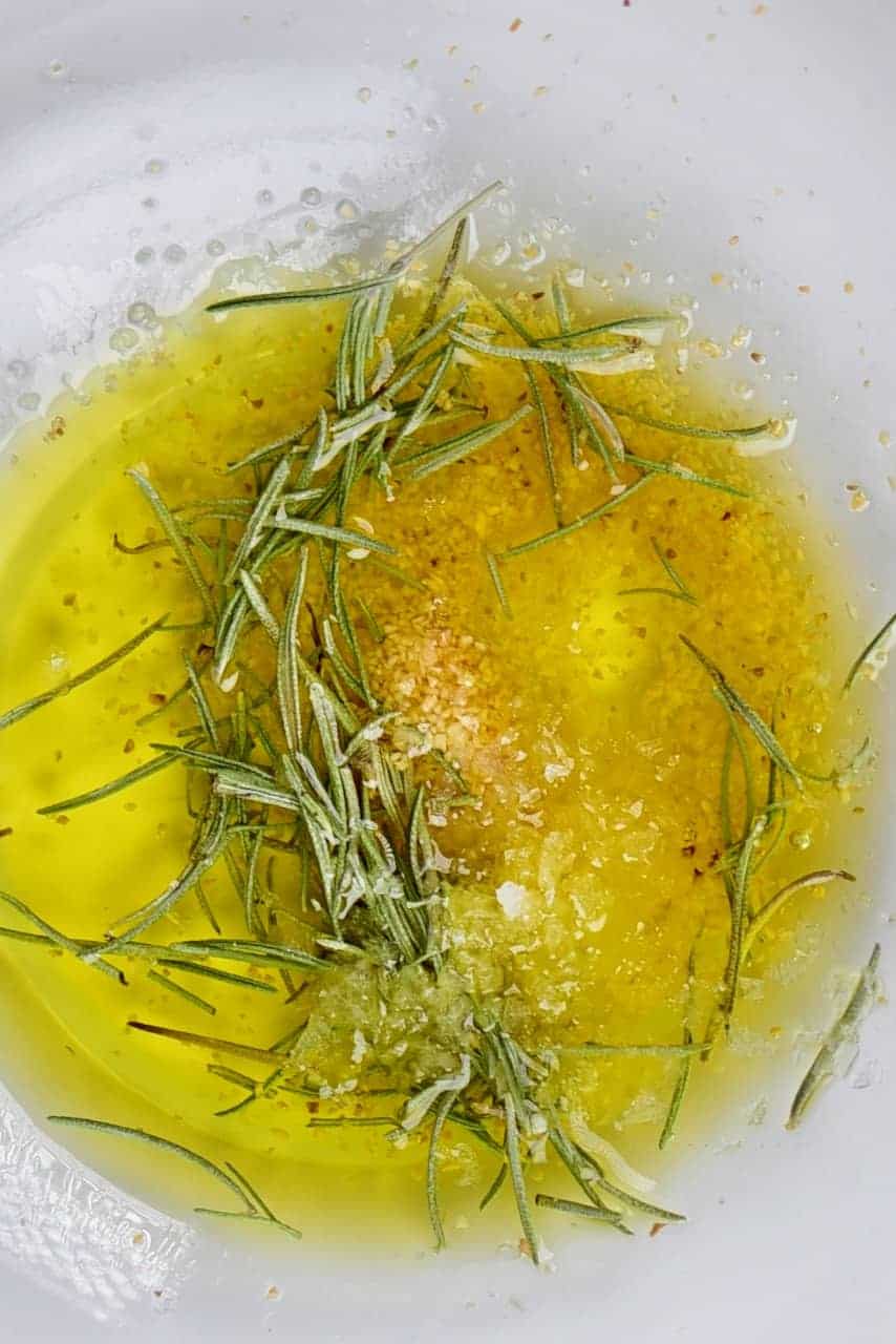 olive oil and seasonings including garlic powder and oregano