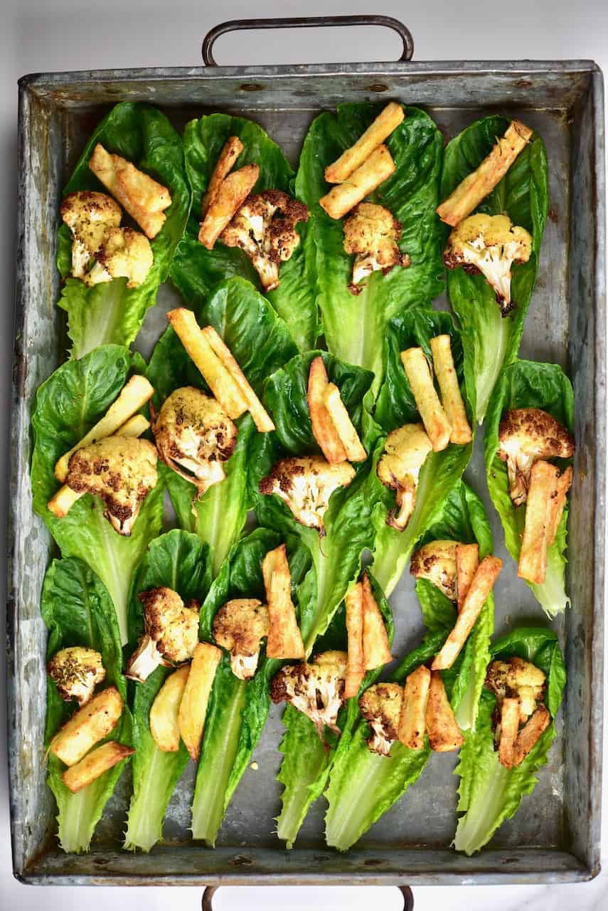 Healthy mediterranean vegetable vegan lettuce wraps with aubergine ( eggplant), cauliflower, potato and salad. 