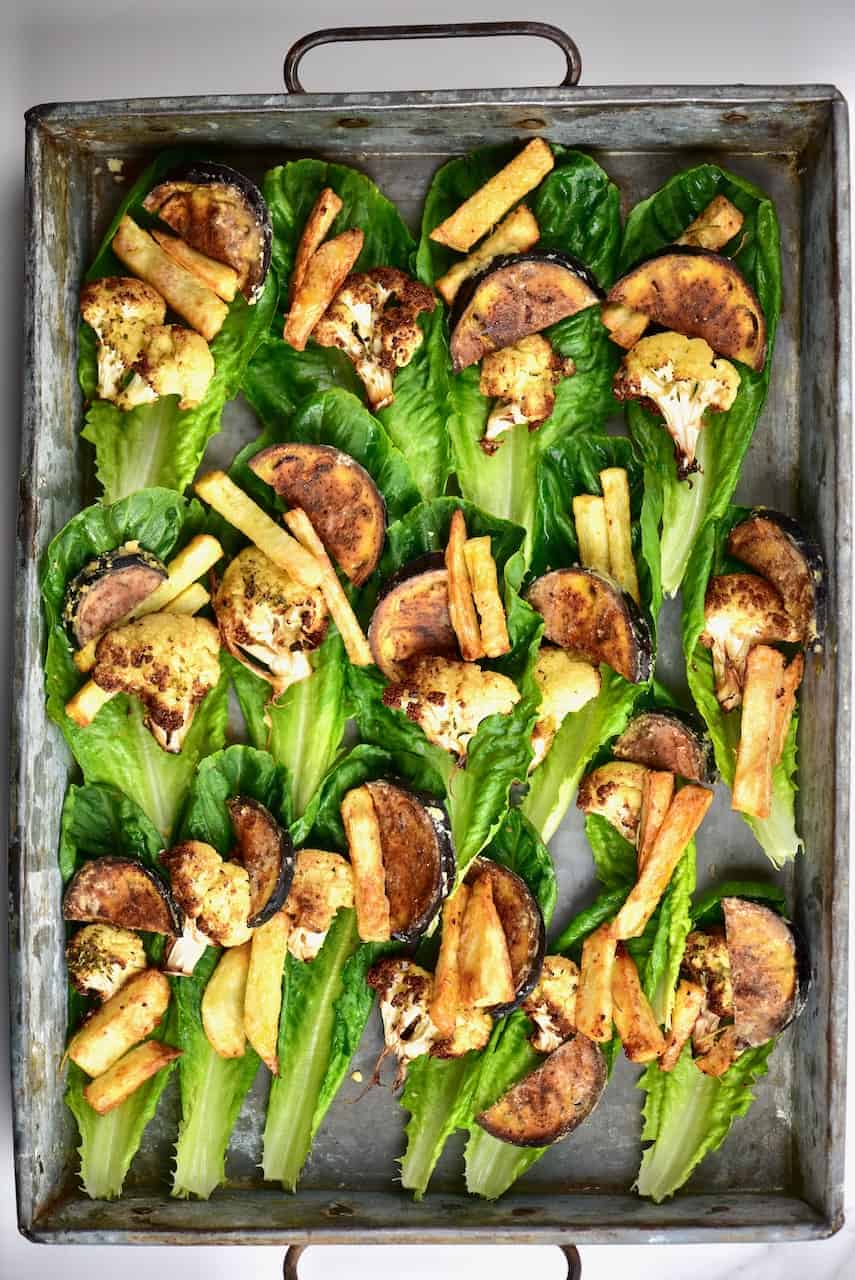 Healthy mediterranean vegetable vegan lettuce wraps with aubergine ( eggplant), cauliflower, potato and salad. Healthy mediterranean vegetable vegan lettuce wraps with aubergine ( eggplant), cauliflower, potato and salad. 