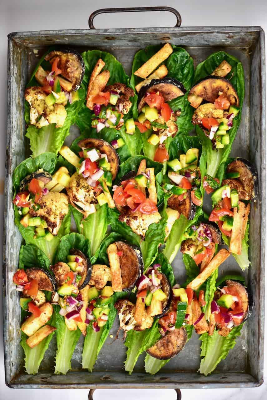 Healthy mediterranean vegetable vegan lettuce wraps with aubergine (eggplant), cauliflower, potato and salad. 