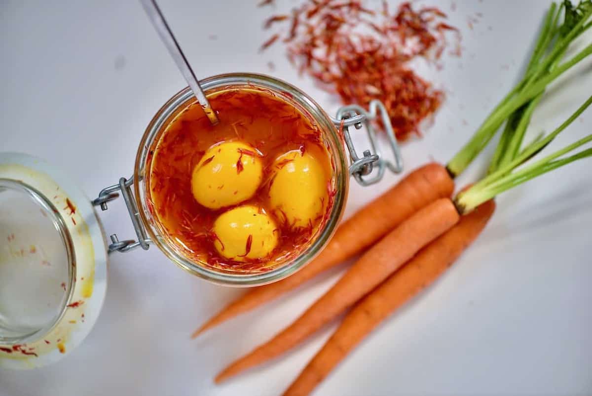 naturally dyed orange pickled quail eggs