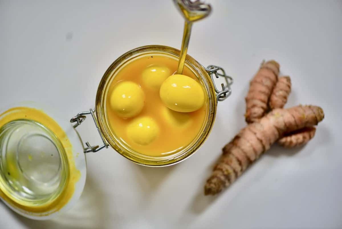 naturally dyed yellow pickled quail eggs