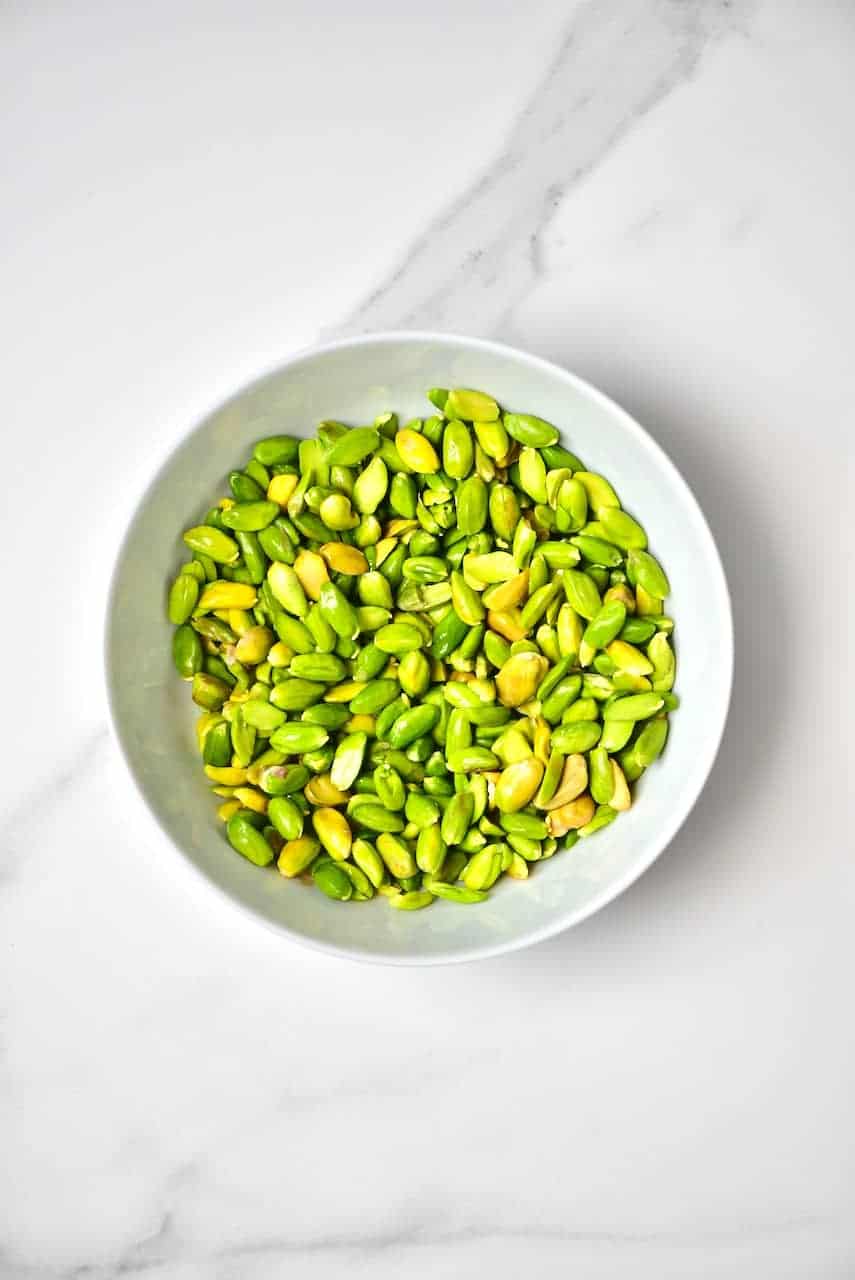 peeled pistachio nuts in a bowl