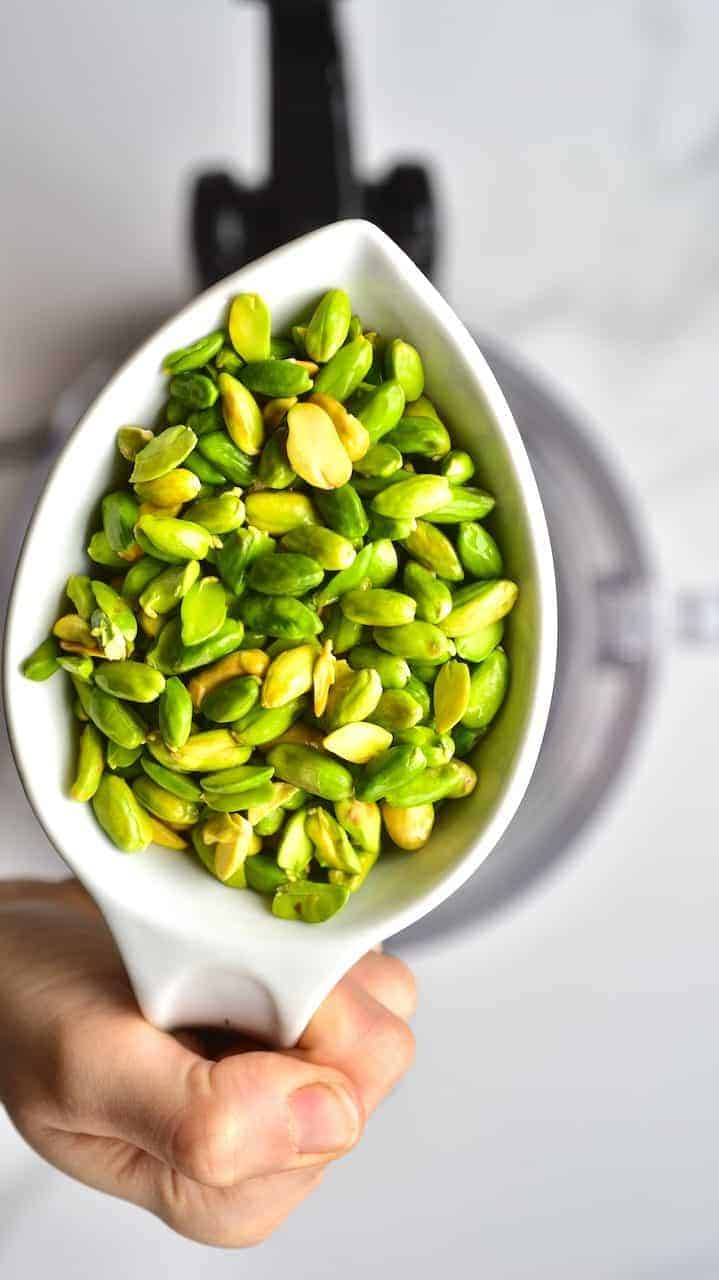 close up of peeled pistachios