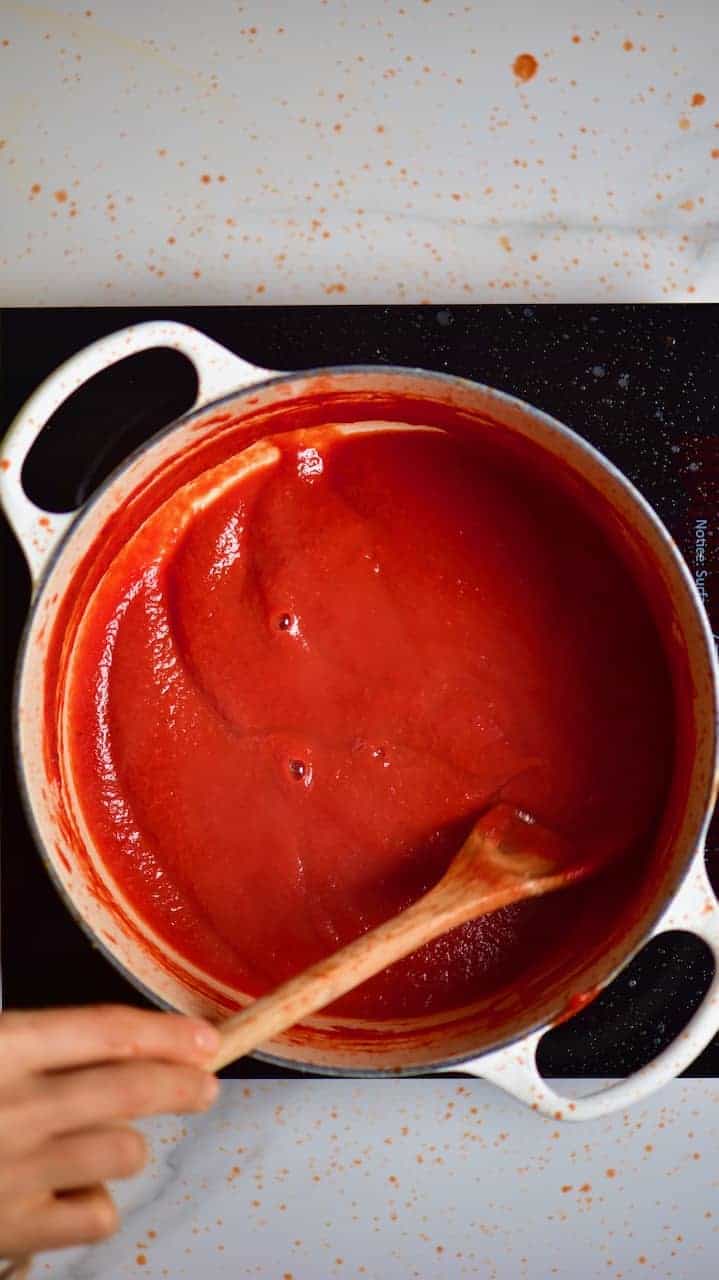 how to make ketchup at home. delicious homemade ketchup in a large pan on top of a stove