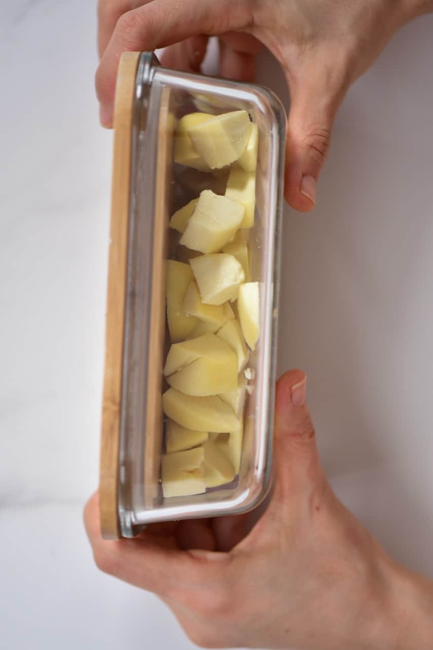 chopped paneer in a glass container