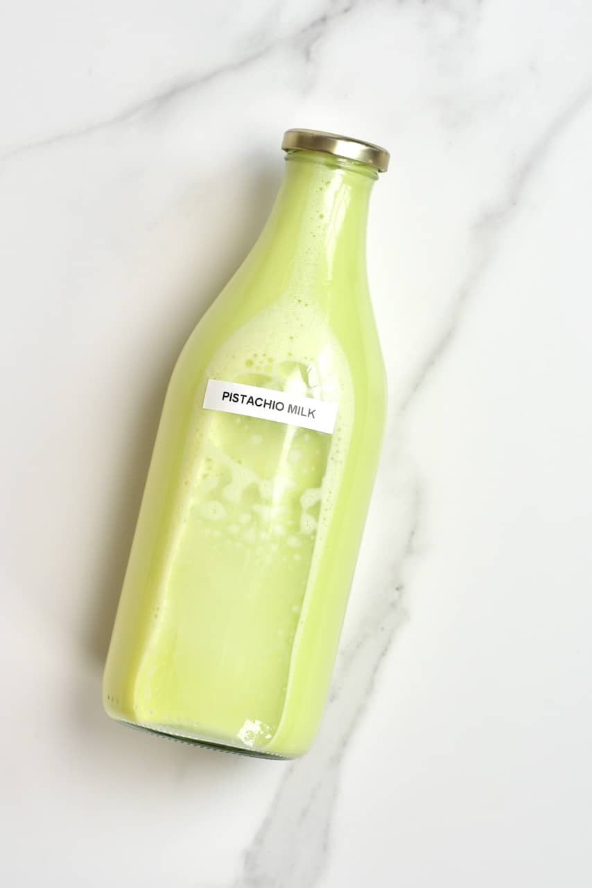 homemade pistachio milk in a bottle - a simple diy pistachio milk recipe