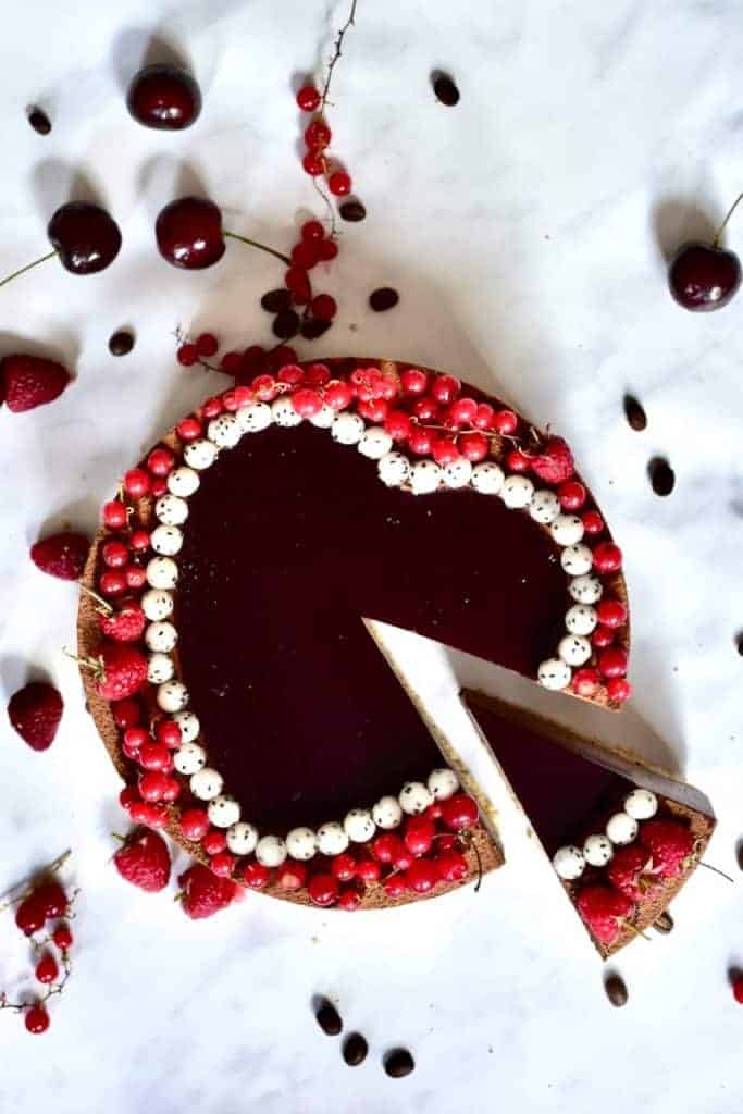 mocha red wine tart with dragonfruit pearls and red berries 