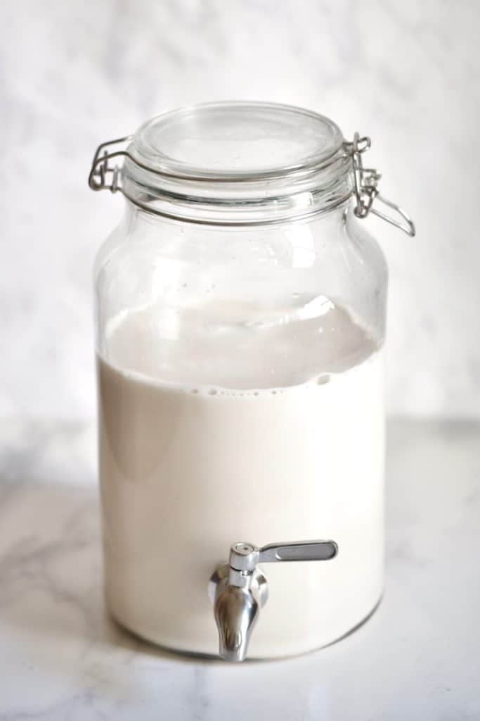 Coconut milk in a big dispenser jar