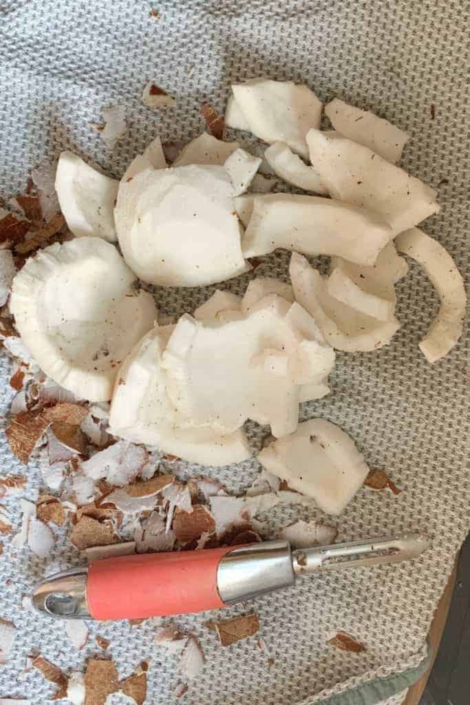 Coconut flesh and a peeler