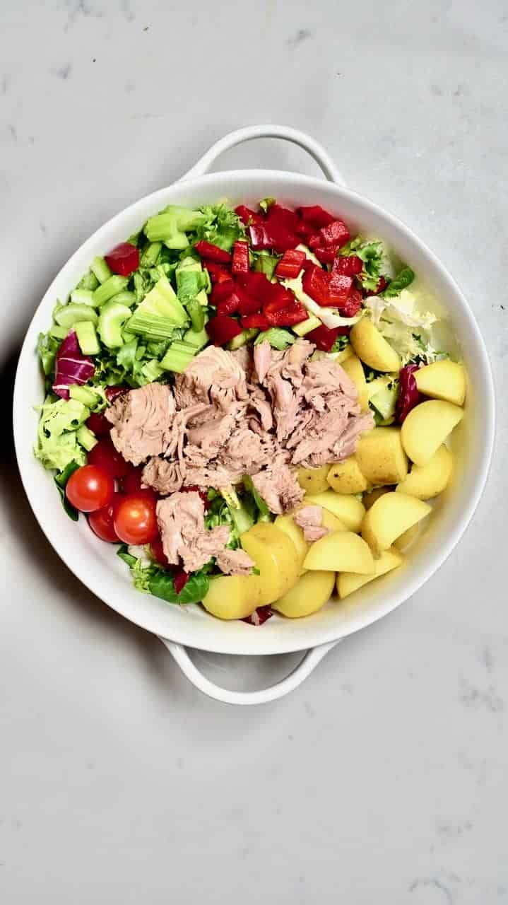 Mixing the main ingredients for Tuna Pomegranate Salad