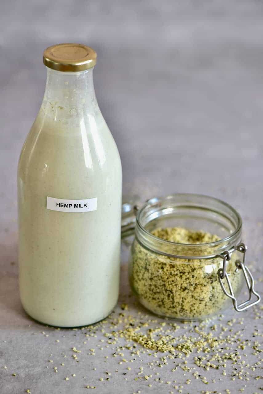 Hemp Milk in a bottle and hemp seeds in a jar
