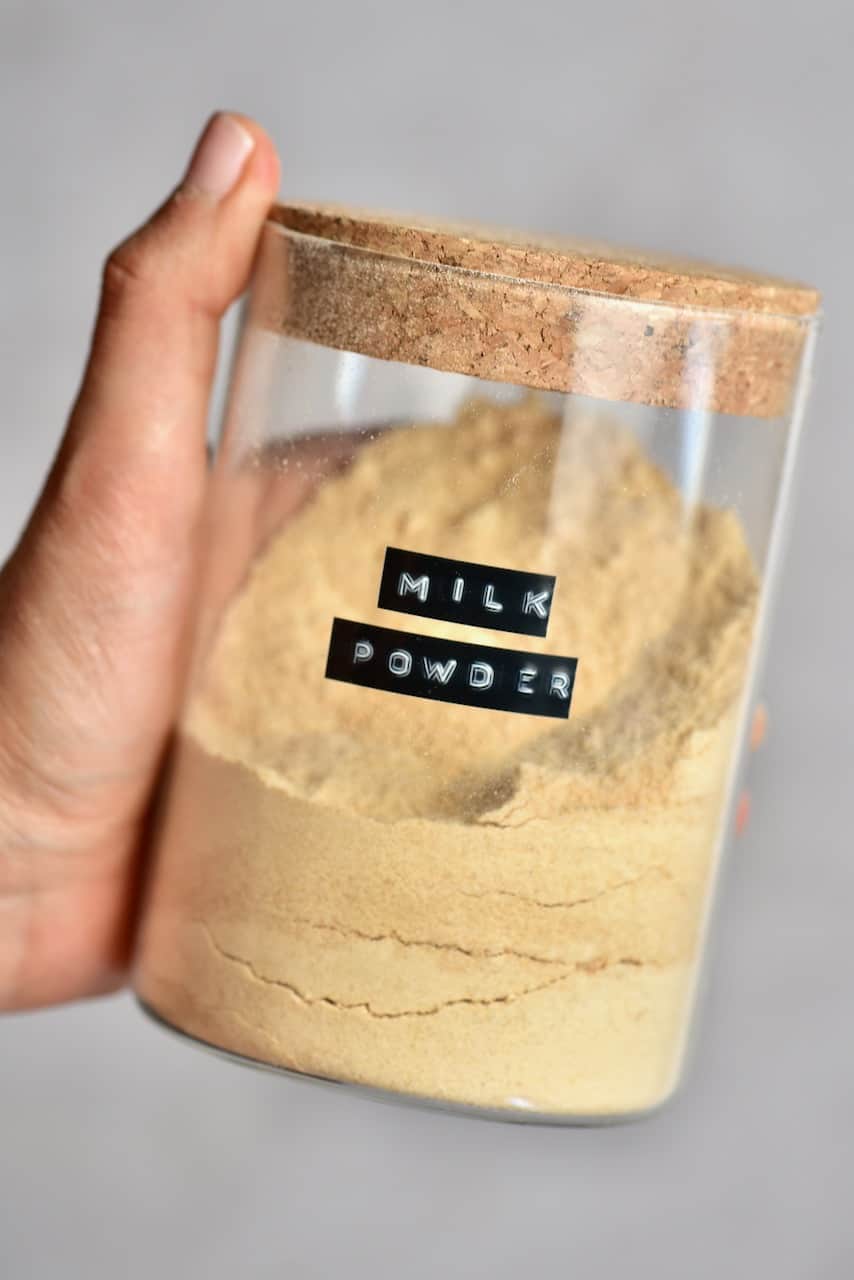 Powdered milk in a glass container