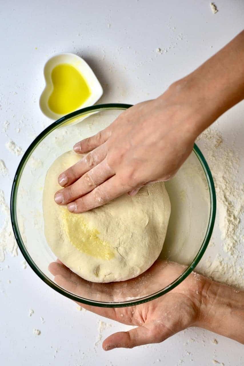Covering the dough with a bit of oil to rest