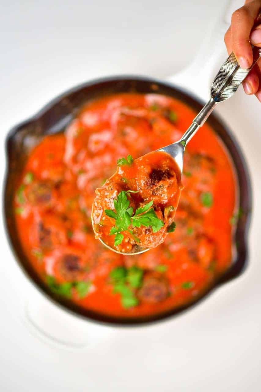 Spoonful of lentil meatballs with tomato sauce