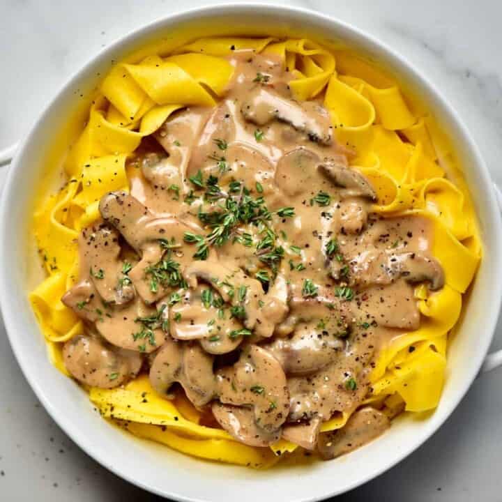A bowl of pasta and vegan mushroom creamy sauce