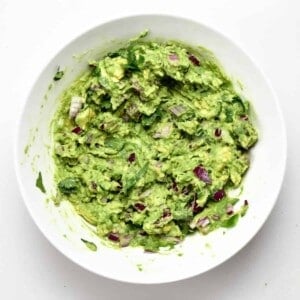 A bowl with homemade mashed guacamole
