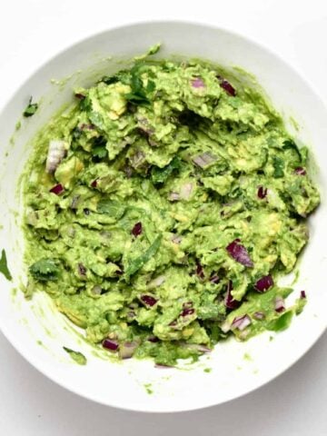 A bowl with homemade mashed guacamole