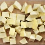 Homemade Paneer chopped into cubes on a wooden board - 18
