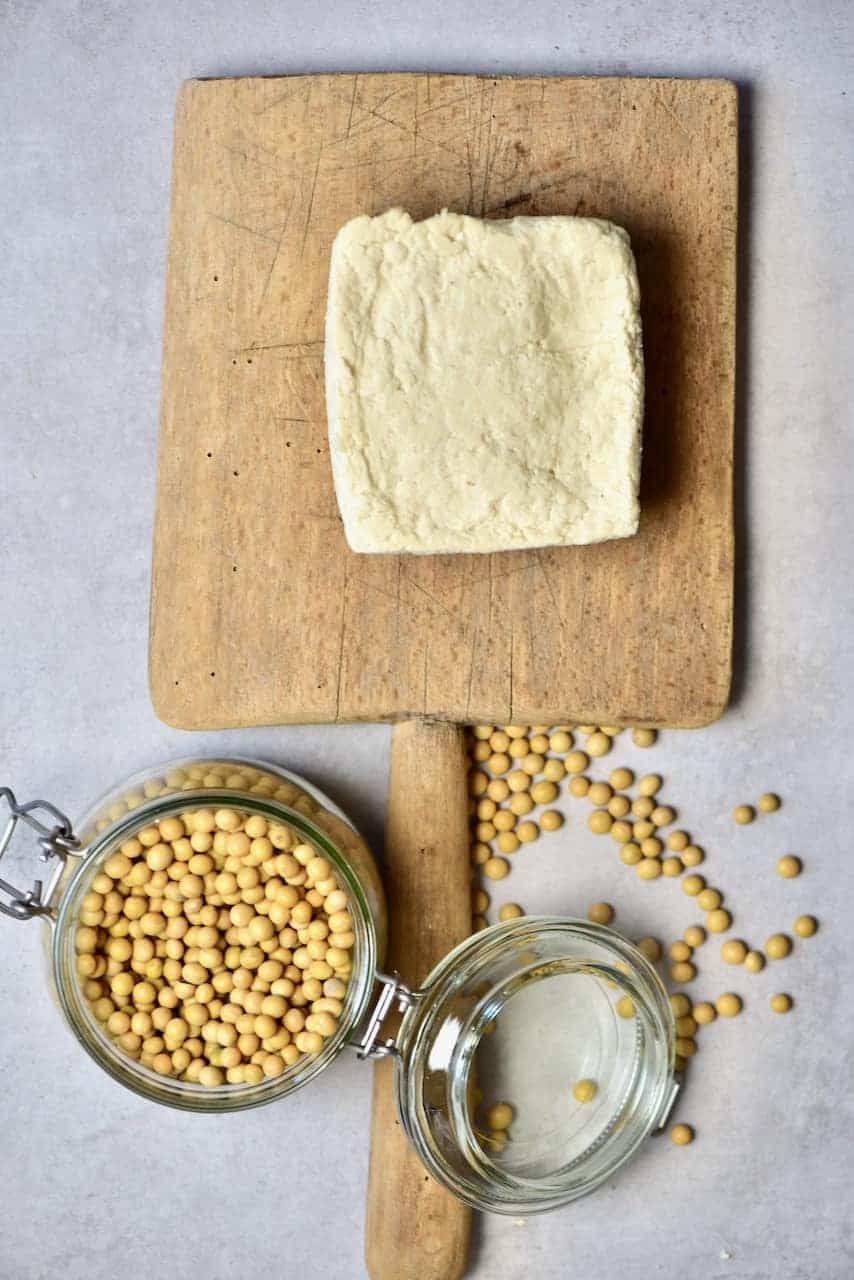 A block of homemade tofu and soybeans