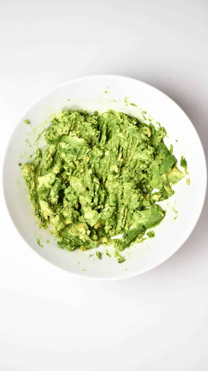Mashed avocados for Traditional Mexican Guacamole
