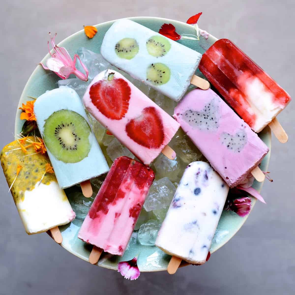 yogurt popsicles over a bowl of ice