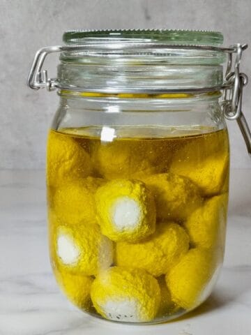Labneh balls in a glass jar with olive oil