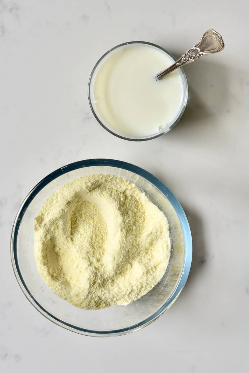 Powdered milk and milk in cup