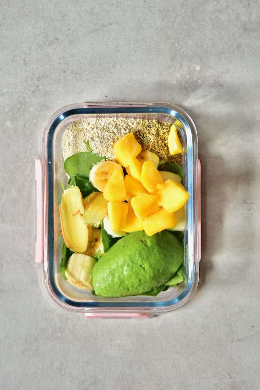 Freezer-safe container with smoothie ingredients