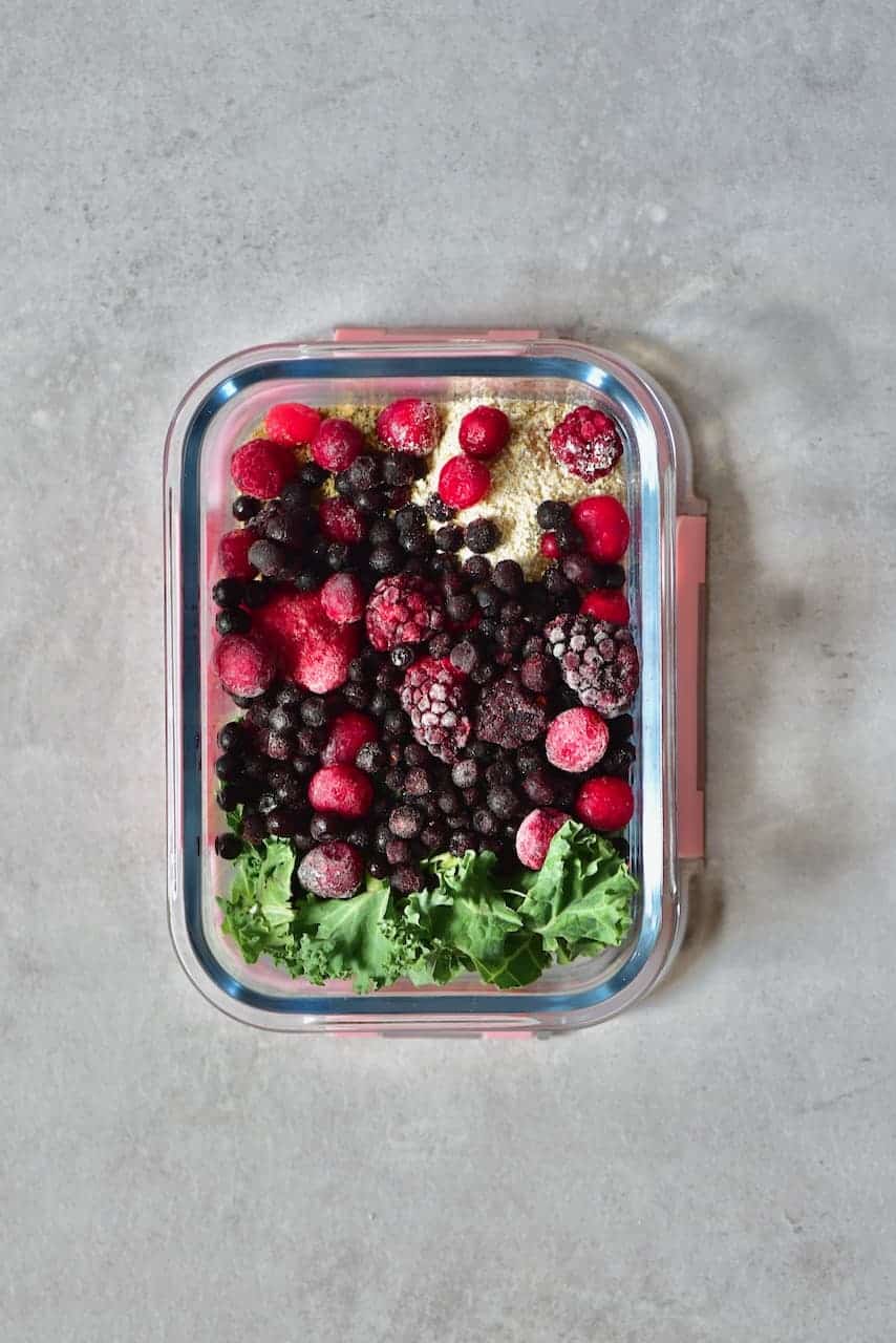 Freezer-safe container with smoothie ingredients