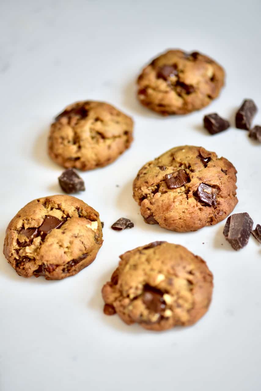 Five Vegan Chocolate Chip Cookies on a surface