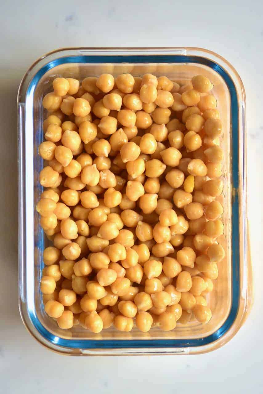 A container with cooked chickpeas