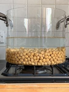 Chickpeas covered with water in a pot