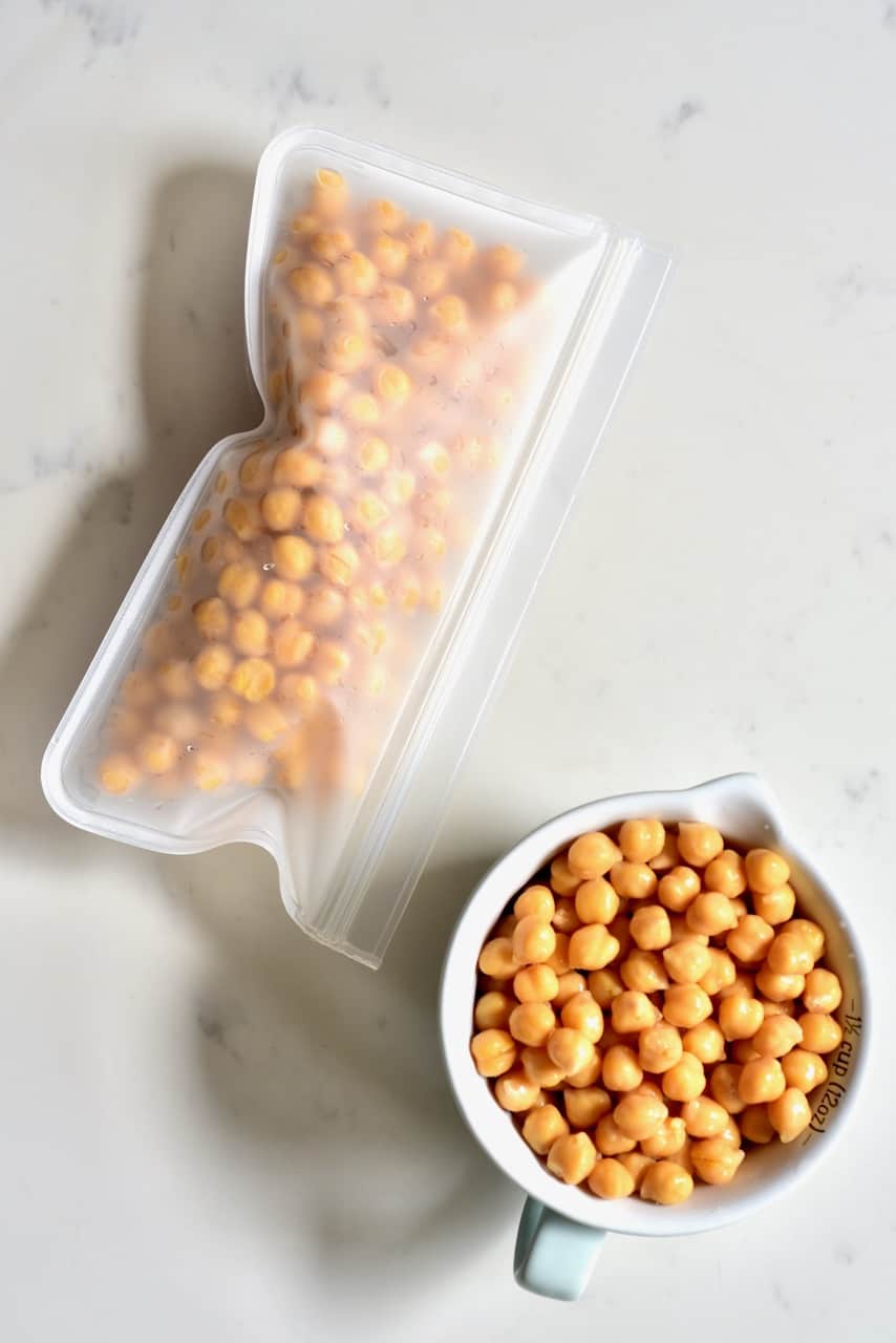 Cooked chickpeas in a cup and freezer bag