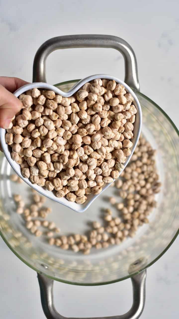 Adding chickpeas to a pot