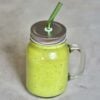 green smoothie jar with glass straw