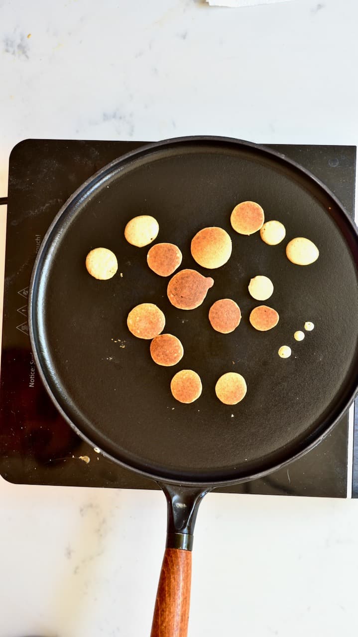 cooked mini pancakes on a pan