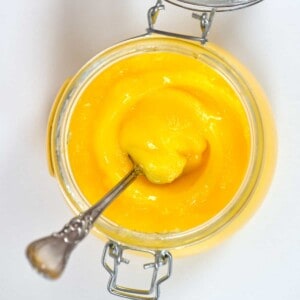 Ghee in a jar with a spoon