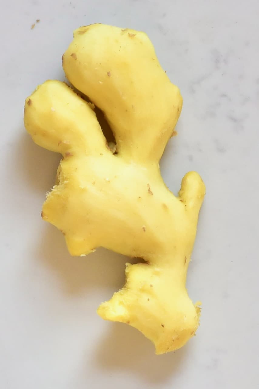 Peeled Ginger Root On marble counter