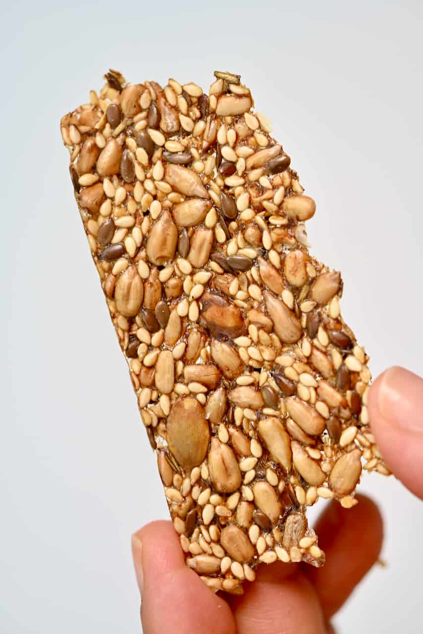 Seeded crackers held in a hand