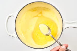 Skimming melted butter in a pot