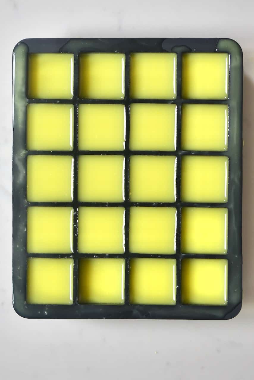 fresh ginger juice inside a black ice cube tray