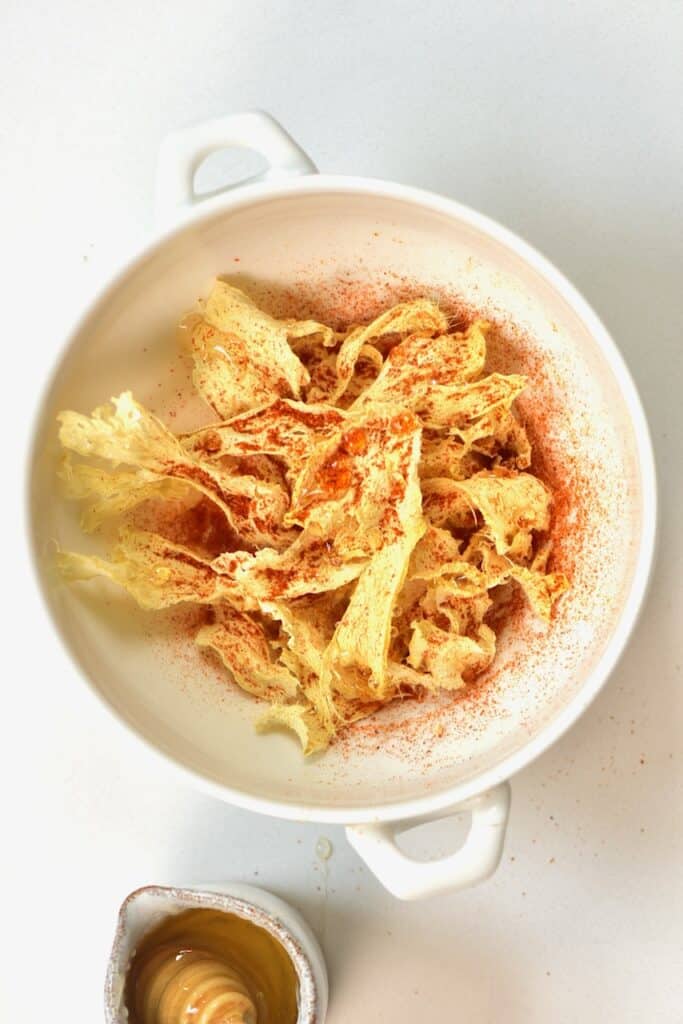ginger chips sprinkled with cayenne pepper and honey
