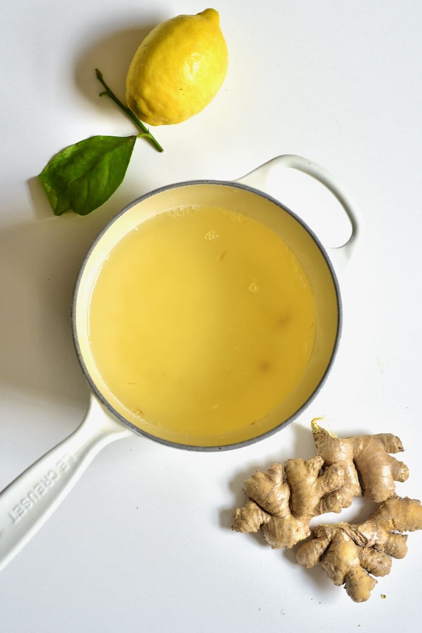 fresh lemon ginger tea in a saucepan