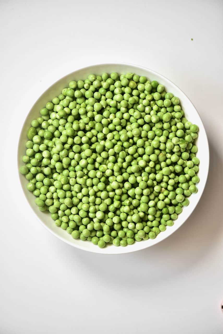 green peas inside a round shaped bowl