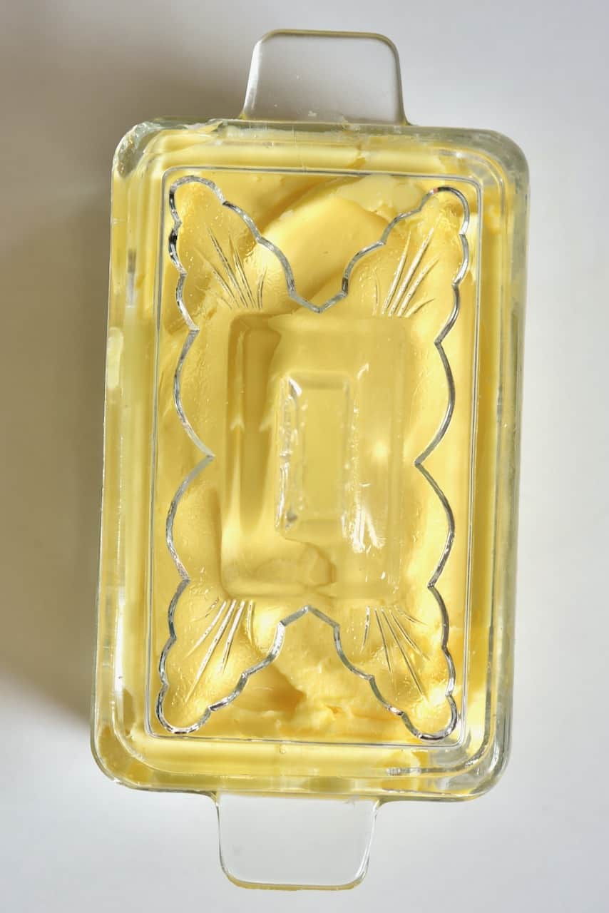 homemade butter in a glass storage container