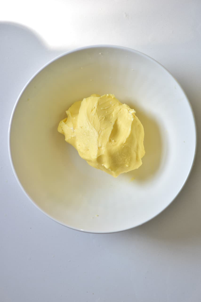 homemade butter inside a white glass bowl