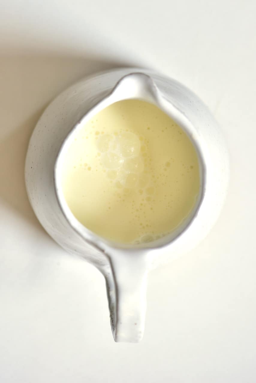 homemade buttermilk in a white jug