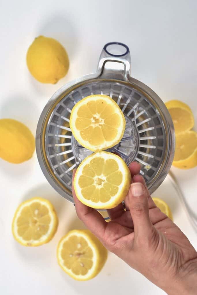 lemon cut in half and lemon juicer