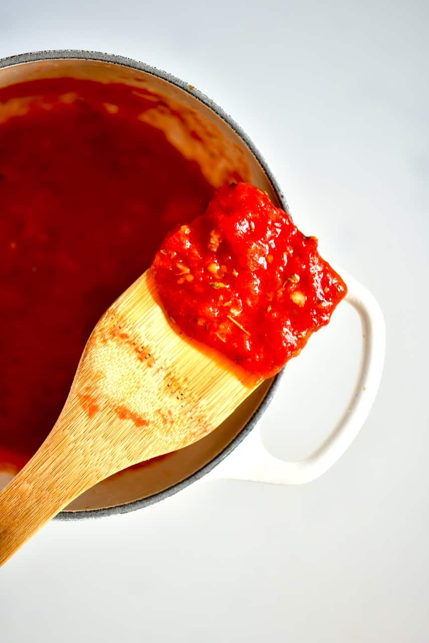 marinara sauce on a wooden spoon
